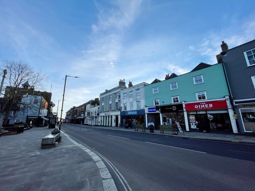 Lot: 145 - MIXED USE COMMERCIAL PREMISES WITH PART VACANT POSSESSION - Street scen outside of All Saints Church in High Street Maldon